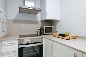 Kuchnia lub aneks kuchenny w obiekcie Guadalquivir Terrace Suite Apartments