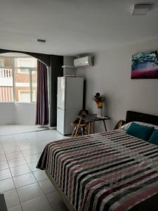 Giường trong phòng chung tại ESTUDIO EMMA