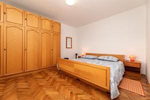 Łóżko lub łóżka w pokoju w obiekcie Apartment Josip Brusic