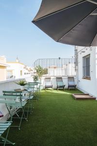 Patio lub wspólna przestrzeń na świeżym powietrzu w obiekcie Guadalquivir Terrace Suite Apartments