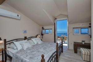 Posteľ alebo postele v izbe v ubytovaní Holiday House Nede