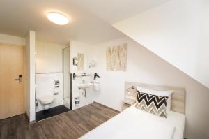 Postel nebo postele na pokoji v ubytování Arthotel ANA Eden