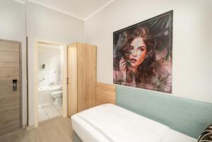 Postel nebo postele na pokoji v ubytování Arthotel ANA Eden