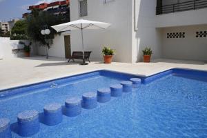 Bazén v ubytovaní AT025 Con piscina, airco, a 150m de la playa alebo v jeho blízkosti