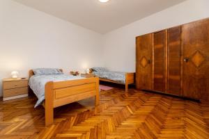 Llit o llits en una habitació de Apartment Josip Brusic