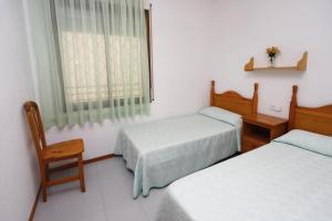 Posteľ alebo postele v izbe v ubytovaní AT025 Con piscina, airco, a 150m de la playa