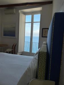 Postel nebo postele na pokoji v ubytování Casa a Mare