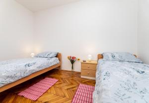 Łóżko lub łóżka w pokoju w obiekcie Apartment Josip Brusic
