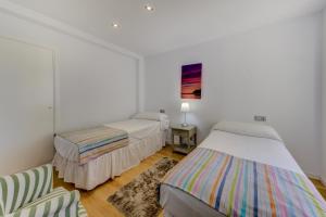 Ένα ή περισσότερα κρεβάτια σε δωμάτιο στο Apartment Faroles 4 By SunVillas Mallorca