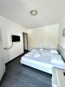Postel nebo postele na pokoji v ubytování Atrium Apartment #1