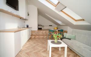 a living room with a couch and a table at House 22A Apartments in Kaunas