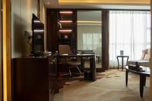 TV a/nebo společenská místnost v ubytování Tianhong Jinling Grand Hotel