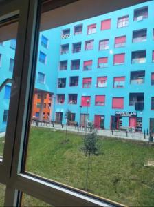 a view of a building from a window at Modern apartment in Tirana in Tirana