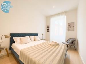 Кровать или кровати в номере Slataper 9 Tirabora Short Rent