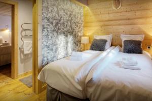 Postel nebo postele na pokoji v ubytování Chalet Victorina - OVO Network