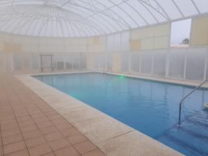 Der Swimmingpool an oder in der Nähe von casa luxury 2 nudista