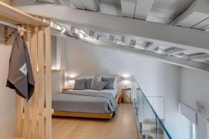 Ένα ή περισσότερα κρεβάτια σε δωμάτιο στο Nomade vibrant living loft