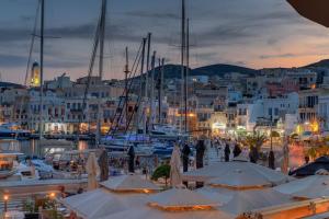 a group of boats docked in a marina at night at Nomade vibrant living loft in Ermoupoli