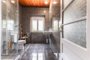 a bathroom with a toilet and a sink at Nine Horizons Belém in Lisbon +183 photos