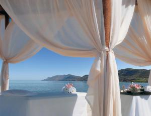 a view from a balcony overlooking the ocean at Azure Beach Villas in Kissamos