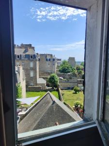 a window view of a city from a building at Ty Brigitte in Dinan