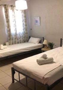 Posteľ alebo postele v izbe v ubytovaní Blue Appartment
