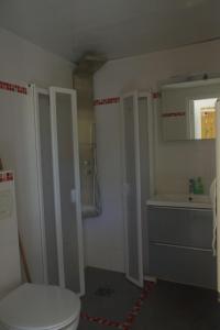 a bathroom with a toilet and a sink at Les Stoechades in Hyères