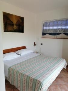 Postel nebo postele na pokoji v ubytování Affitti Brevi nel Golfo di Gaeta Alloggio
