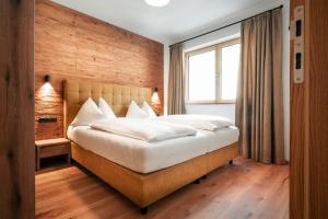 Postel nebo postele na pokoji v ubytování Sun Side by Schladming-Appartements