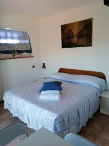 Postel nebo postele na pokoji v ubytování Affitti Brevi nel Golfo di Gaeta Alloggio