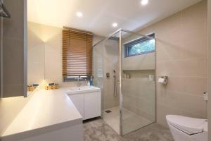 a bathroom with a shower and a toilet and a sink at PPP Seoul in Seoul