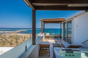 a view of the beach from the balcony of a house at Kriti Beach Hotel in Rethymno