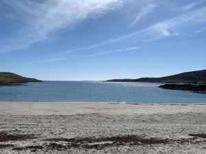 a beach with a large body of water at Islesburgh House Hostel in Lerwick