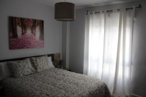 Postel nebo postele na pokoji v ubytování INCREIBLE APARTAMENTO CENTRO GRANADA ALHAMBRA