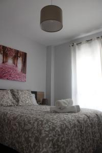 Postel nebo postele na pokoji v ubytování INCREIBLE APARTAMENTO CENTRO GRANADA ALHAMBRA