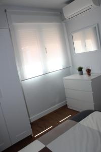 Postel nebo postele na pokoji v ubytování INCREIBLE APARTAMENTO CENTRO GRANADA ALHAMBRA