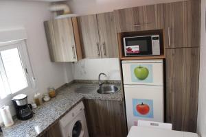 Kuchyň nebo kuchyňský kout v ubytování INCREIBLE APARTAMENTO CENTRO GRANADA ALHAMBRA