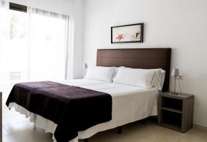 Un pat sau paturi într-o cameră la BA Style Apartments Ibiza