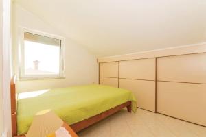 Posteľ alebo postele v izbe v ubytovaní Apartman Maura