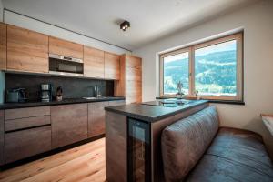 Kuchyň nebo kuchyňský kout v ubytování SUN SIDE by Schladming Appartements