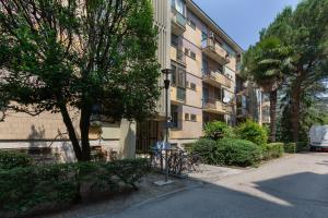 an apartment building with bikes parked next to a street at Prospettiva Corso Giovecca apartment in Ferrara
