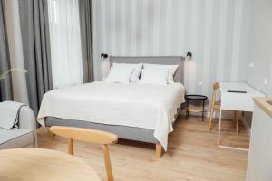 Postel nebo postele na pokoji v ubytování Aparthotel Amella