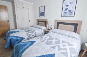 Posteľ alebo postele v izbe v ubytovaní Apartamentos Turísticos Hornillo AT-CC-00681