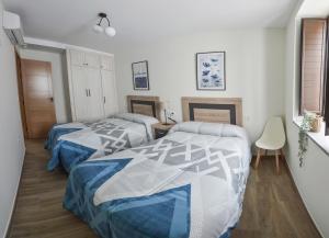Posteľ alebo postele v izbe v ubytovaní Apartamentos Turísticos Hornillo AT-CC-00681