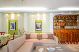 a living room with a couch and a table at Naxos Hotel Savvas in Naxos Chora