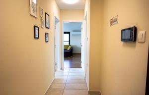 a hallway with a tv on a wall at Апартамент за гости Русе Център-Придунавска (Дунав) in Ruse