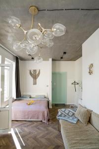 Postel nebo postele na pokoji v ubytování House 22A Studio Apartments