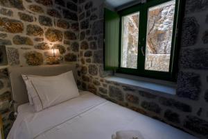Postel nebo postele na pokoji v ubytování ERMIS-APEA Villas