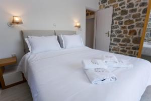 Postel nebo postele na pokoji v ubytování POSEIDON-APEA Villas + 37 fotografií