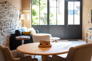 Posezení v ubytování Paddock Lodge - Suites Wellness & Chambres d'hôtes